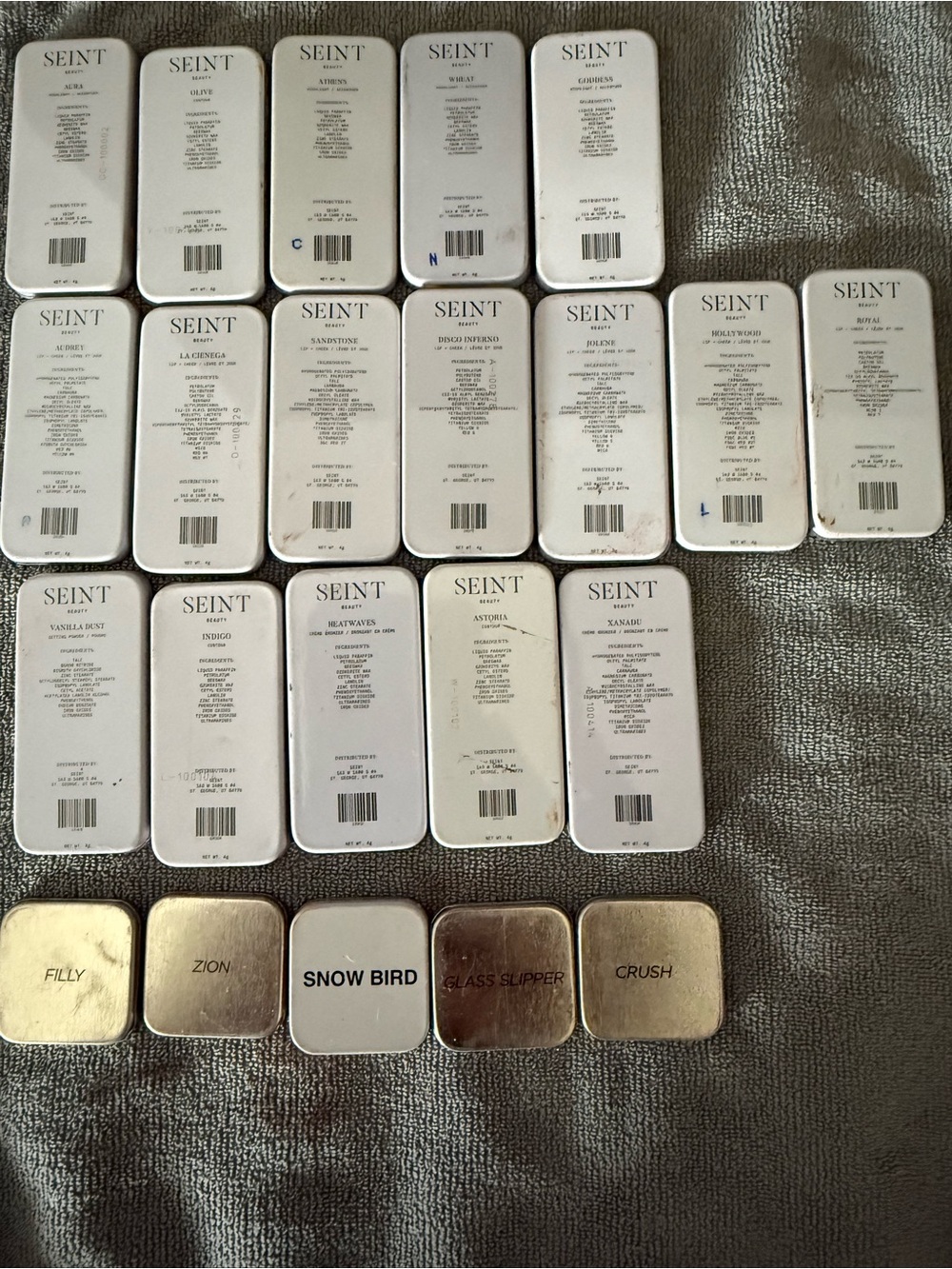 Large lot of Seint makeup and palettes